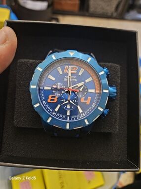 Invicta Blue Watch with Orange Numeral Accents